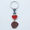 Detail view of metal keychain with blue letter I, red heart, and brown dog pendant - Curly Dog Head Style (16)