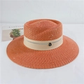Detailed macro of orange straw sun hat featuring sparkling sequins and a metallic 'T' buckle - M (56-58cm) Adjustable / Orange Red