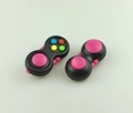 Detail of black fidget controller toys featuring colorful silicone buttons and smooth texture - Rose Red with OPP Bag and String