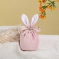 Detailed close-up of pink velvet Easter bunny ear drawstring bag with ribbon bow - Large / Foggy Pink