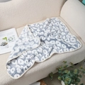 Soft grey and white leopard print pet blanket on a cozy beige sherpa sofa - Grey Lips