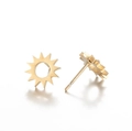 Macro shot of gold sunburst star stud earrings with hollow geometric center details - Hollow Sun Style (417) / Gold