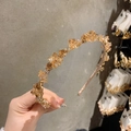 Detailed view of amber crystal beads on a handmade luxury vintage headband for women - Champagne