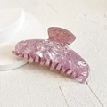 Macro detail of lavender rhinestone hair claw clip showing polished texture and sparkling crystals - Pink Rhinestone