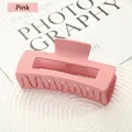 Matte pink large rectangular hair claw clip for thick hair shown on a white tray - Pink