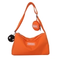 Bright orange nylon crossbody bag with fashion label and plush sprite charm accessory - With Pendant / Orange
