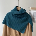 Close-up of a peacock blue turtleneck knit shawl over a camel coat for winter layering - Peacock Blue