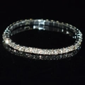 Detail shot of a single row sparkling crystal rhinestone bracelet on a black background - 1 Row Silver Clear Rhinestone Bracelet
