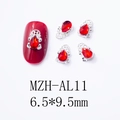 Macro view of 6.5x9.5mm red teardrop zircon nail charms with silver ornate base - Silver Red Zircon Drop Style (AL11)