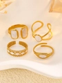 Four vintage irregular gold open rings with white enamel on a white artistic base - Stainless Steel White Enamel Drip Oil Ring Set (4Pcs) (18 不锈钢滴油戒指4个)