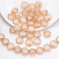 Vue détaillée de perles de verre rondes à motif spirale doré champagne pour bijoux DIY - Or Ambre