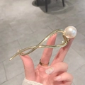 Elegant gold metal hair clip with a large cream pearl and stylish twisted design - Gold Large Pearl Twist Hair Clip