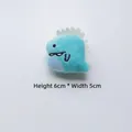 Detailed close-up of a blue plush dinosaur accessory with 6cm height and 5cm width - Side Blue Dinosaur (Back Opening)