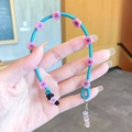Blue silicone hair braiding rope featuring pink floral accents and clear bead pendant - Straight Braid / Blue Flower