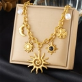 Gold-plated stainless steel chain with sun, moon, and pearl charms on a display stand - Sun Moon Sea Star Pearl Style (N3316)