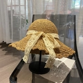 Handwoven straw sun hat in light brown with decorative cream lace bow and wavy brim - One Size / Striped Lace Ribbon - Khaki