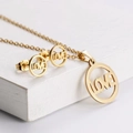 Titanium steel jewelry set with gold LOVE hollow ring necklace and matching stud earrings - Hollow Circle LOVE