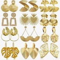 Set of 12 pairs boho gold earrings including geometric discs, leaves, and floral shapes - Geometric Metal Earrings Set / Gold