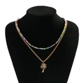 Collar de doble capa con cuentas de colores y colgante de palmera dorada - Dorado