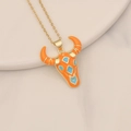 Macro shot of gold bull head pendant with orange and blue enamel inlay on a chain - Orange Blue Enamel Ethnic Bull Head Style (21#)