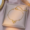 Gold-plated stainless steel bow necklace with small beads and lobster clasp closure - Bow Bead Anklet / Gold
