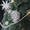 Sparkling white and silver pine cone ornament hanging on a festive Christmas tree branch - 6CM Silver Edge Pine Cone 6pcs Set