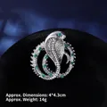 Detail of silver cobra brooch with green emerald gems and snake skin texture - Silver Snake Ring with Green Eyes (XZ24149)