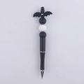 Detail of DIY beaded pen featuring a black cartoon bat topper and silicone beads - Little Bat