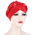 Red paisley print turban hat with braided twist design on female mannequin - Patchwork Red Floral