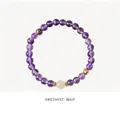 Elegant purple amethyst beaded bracelet with gold accents and a white feature stone - Natural Amethyst Jade Style (WB335)