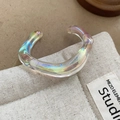 Close-up of an iridescent resin cuff bracelet with a streamlined open C-shape design - Iridescent Streamline Resin Bangle