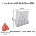 Vue détaillée du moule à bougie en silicone à bulles avec échantillon de bougie orange fini - Sphère à Bulles à Quatre Niveaux