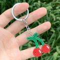 Handmade beaded cherry keychain with red and green beads for bohemian fashion accessories - Cherry