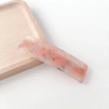 Minimalist acetate hair clip featuring a pink and white marble pattern design - Metallic Pink