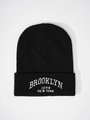 Detailed view of Brooklyn 1898 white embroidery on black ribbed knit beanie cuff - One Size / Black