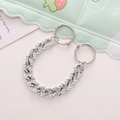 Close-up of silver rhinestone Cuban chain shoe charms with round spring clasps - Silver Rhinestone Cuban Chain