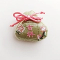 Detailed view of 5x5.5cm green silk pouch brooch with pink floral embroidery and tie - Green (Auspicious)