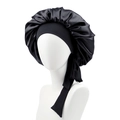 Detail of black satin sleep cap with long adjustable straps and shiny silk texture - Black
