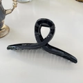 Macro view of a 15cm glossy black hair claw clip featuring a cross-wrap minimalist design - Hanger (Approx 15cm) / Black Shiny Surface