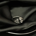 Close-up of teardrop zircon open ring with multi-layered silver metal on black silk - Adjustable Open / Silver Multi-line Wrap