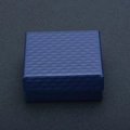 Blue square jewelry gift box with diamond texture on a dark grey professional background - 7*7 Universal Box Blue