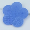 Light blue flower-shaped silicone makeup brush cleaning mat with suction cups - Blue