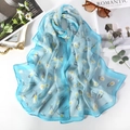 Blue floral georgette scarf with yellow blossoms displayed with sunglasses - 160*50CM / Tulip Light Blue