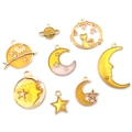 Flat lay view of gold star and moon enamel charms for DIY celestial jewelry making - Yellow Series (HK518) / Set of 8 / Yellow
