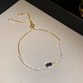 Bracelet œil de protection plaqué or avec zircon bleu et fermoir réglable - Style Bolo Mauvais Œil Doré (11# Bracelet - Or - Bleu - Ajouré)