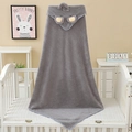 Plush grey elephant hooded baby towel in coral fleece draped on a white wooden crib - 80*80cm / Grey Elephant