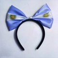 Argentine flag headband featuring large blue and white striped bow with Sun of May emblem - Argentina Flag