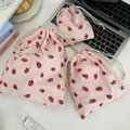 Detailed texture of pink corduroy storage bags with strawberry prints and cream drawstrings - Medium (19*24cm) / Strawberry Pink