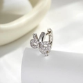 Elegant silver bow huggie hoop earrings with sparkling cubic zirconia on white background - Bow-knot Ear Buckle Single Piece (A-842)