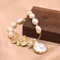 Baroque natural pearl bracelet with golden floral charms and flat pearl pendant - Leaf Edged Pearl Bracelet